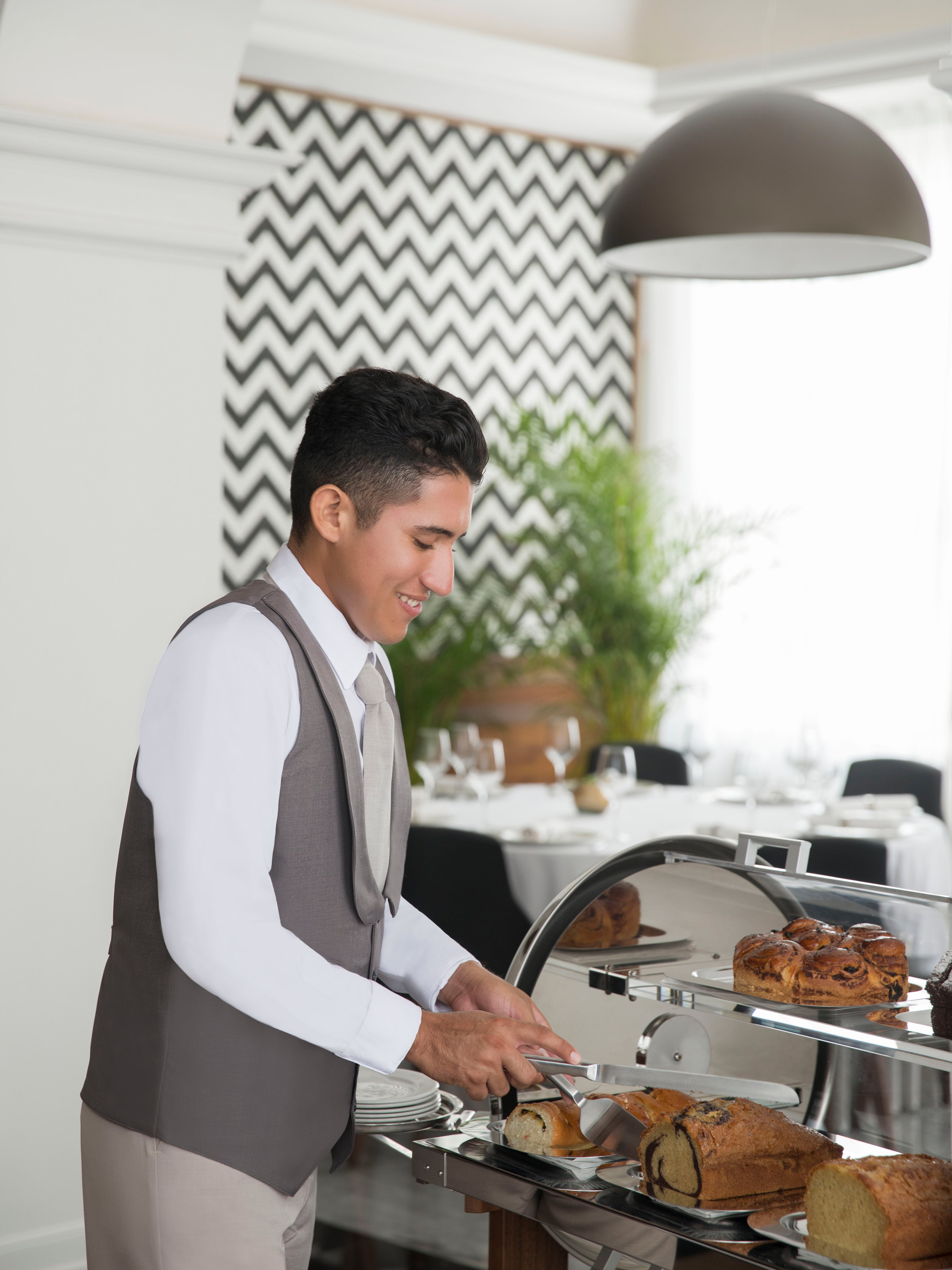 Waiter Serving Bread at a Resort Restaurant